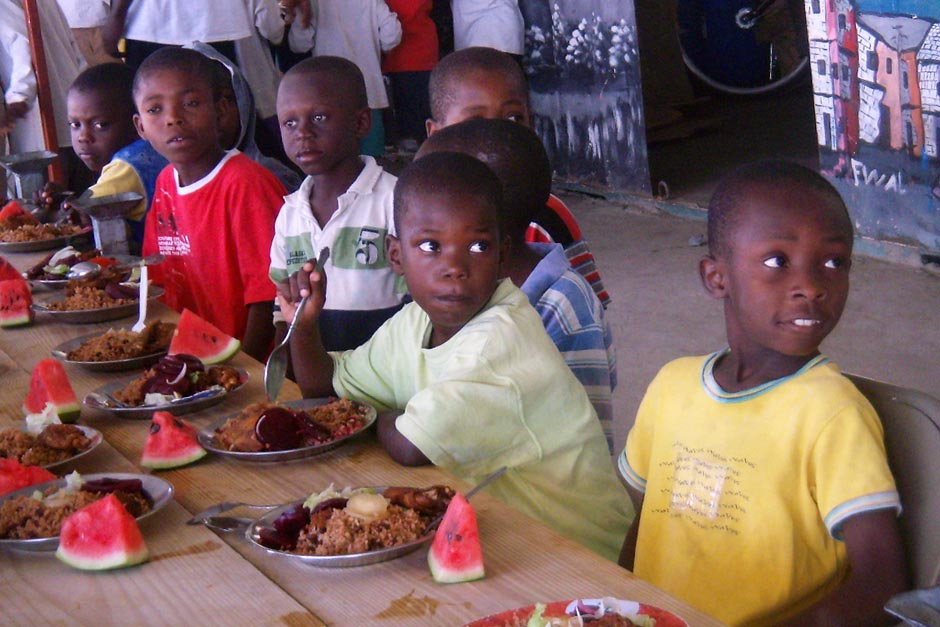 Haitian children eating food